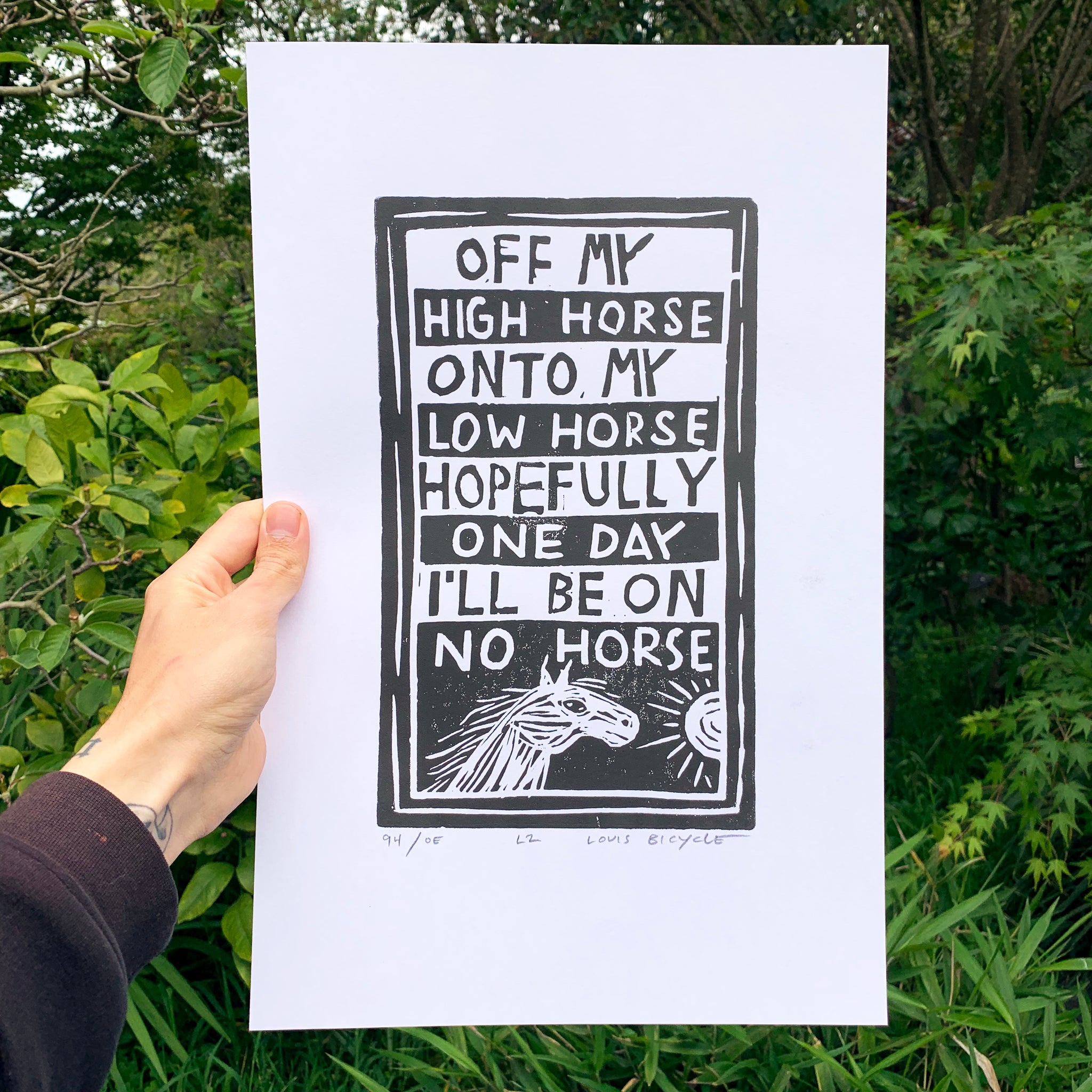 Block printed poster by artist Louis Bicycle. Text "Off my high horse, onto my low horse, hopefully one day, I'll be on no horse."